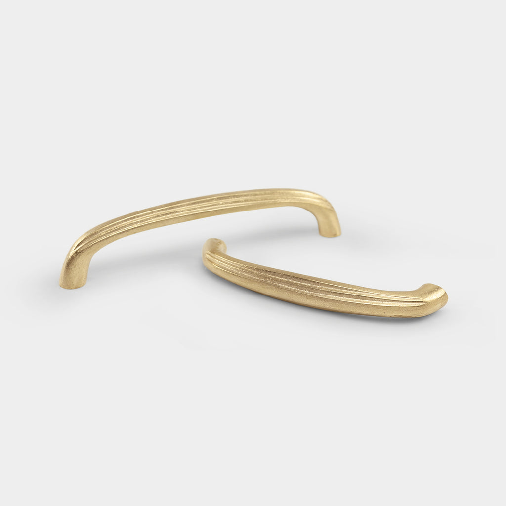 Coard brass cabinet pull with a sleek and modern design, ideal for contemporary spaces.