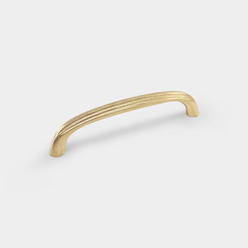 Coard large brass pull handle, adding a touch of luxury to your furnishings.