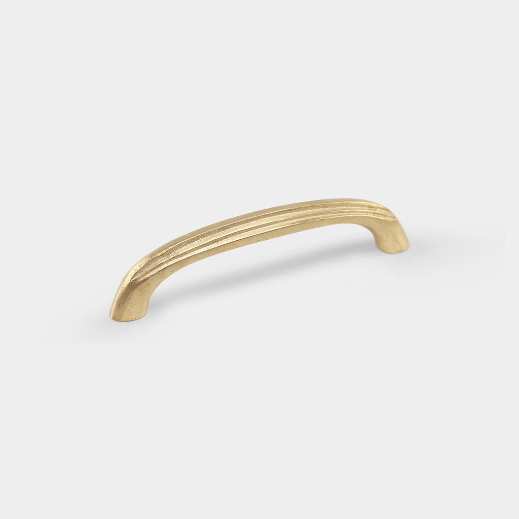 Coard small brass pull handle with a sleek, modern design.