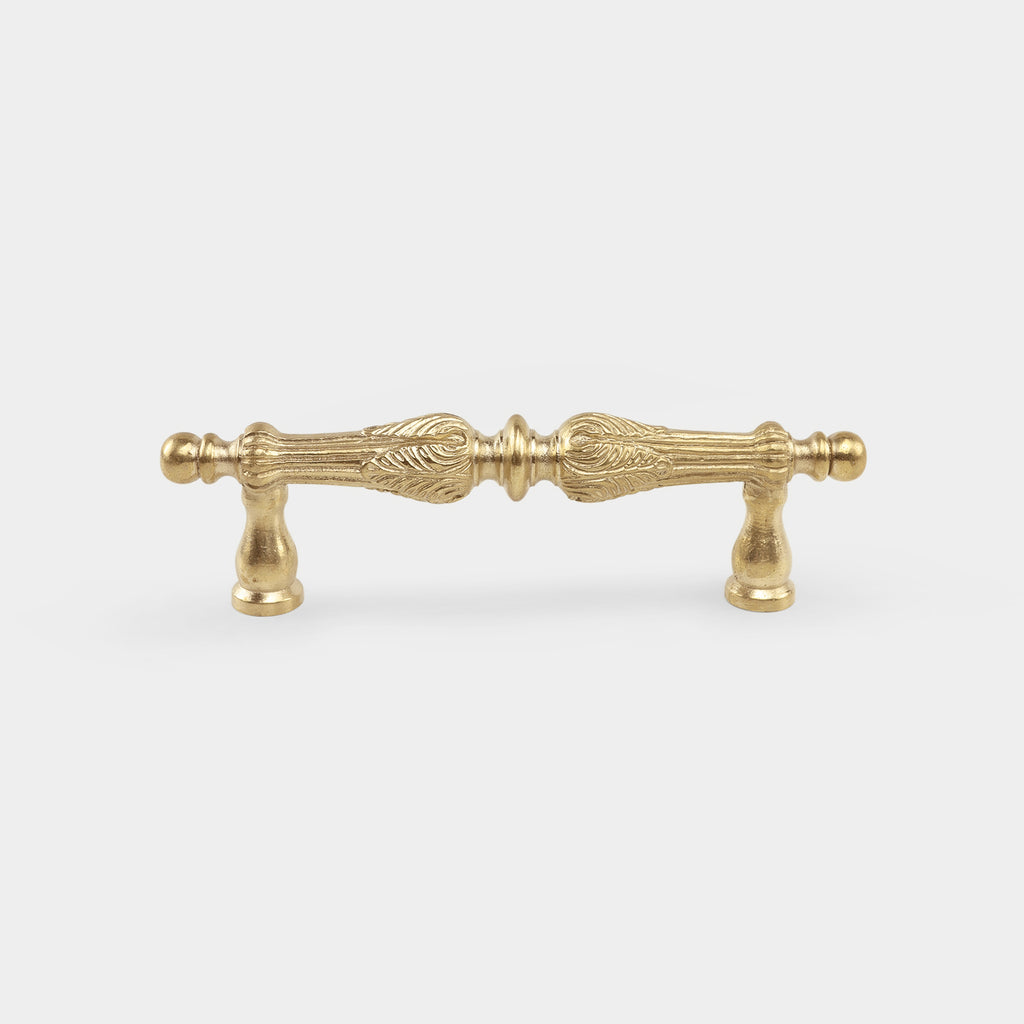 Lepautre brass pull handle, adding sophistication to your furnishings.