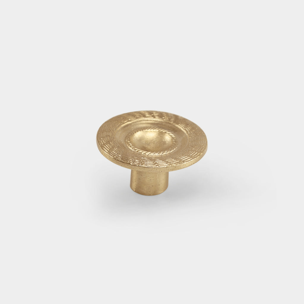 Brass Molitor cabinet knob featuring a sleek, timeless design.